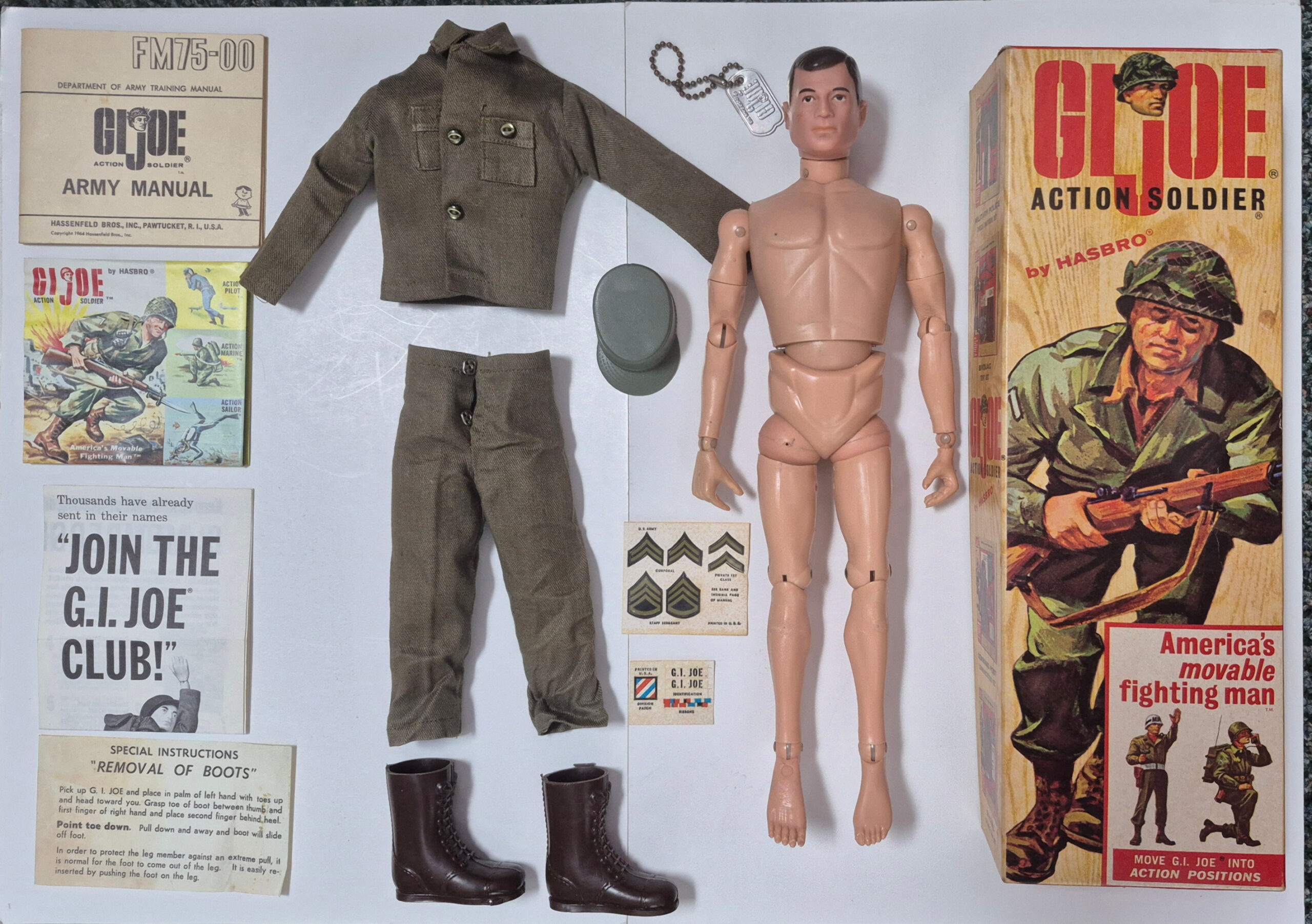 hasbro-1964-gi-joe-action-soldier-in-7500-box-1 1964 Hasbro G.I. Joe Action Soldier in Fatigues Uniform in 7500 Box with Paperwork 1